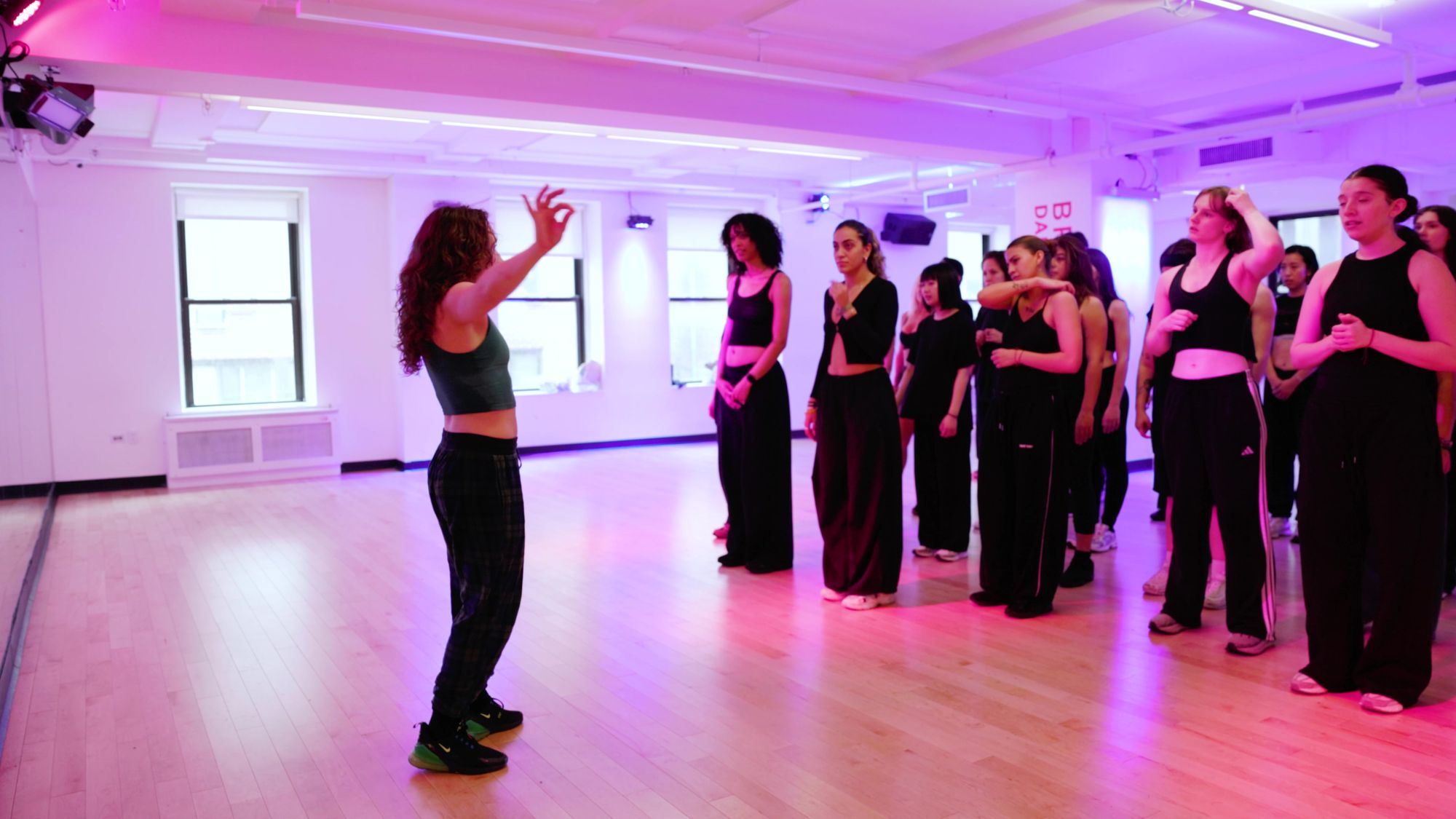 Galit explaining a count to a line of dancers at Broadway Dance Center